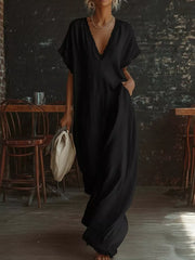 Black lace-trimmed V-neck maxi dress with pockets and short sleeves.