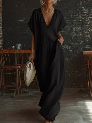 Black lace-trimmed V-neck maxi dress with pockets and short sleeves.