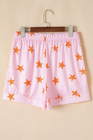 Blush pink pajama shorts with orange stars and elastic waistband.