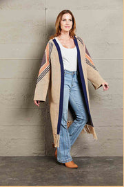 Khaki long cardigan with geometric trim, navy blue trim, and fringed hemline.