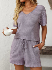 Lilac ribbed V-neck loungewear set with drawstring shorts and short sleeves.