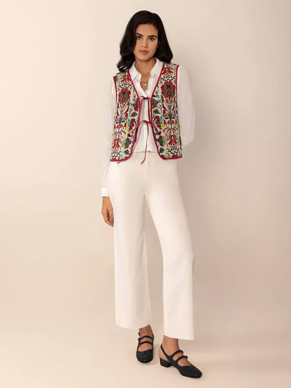 Embroidered tie-front cropped vest coat in cream with red trim and floral embroidery.