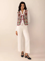 Embroidered tie-front cropped vest coat in cream with red trim and floral embroidery.