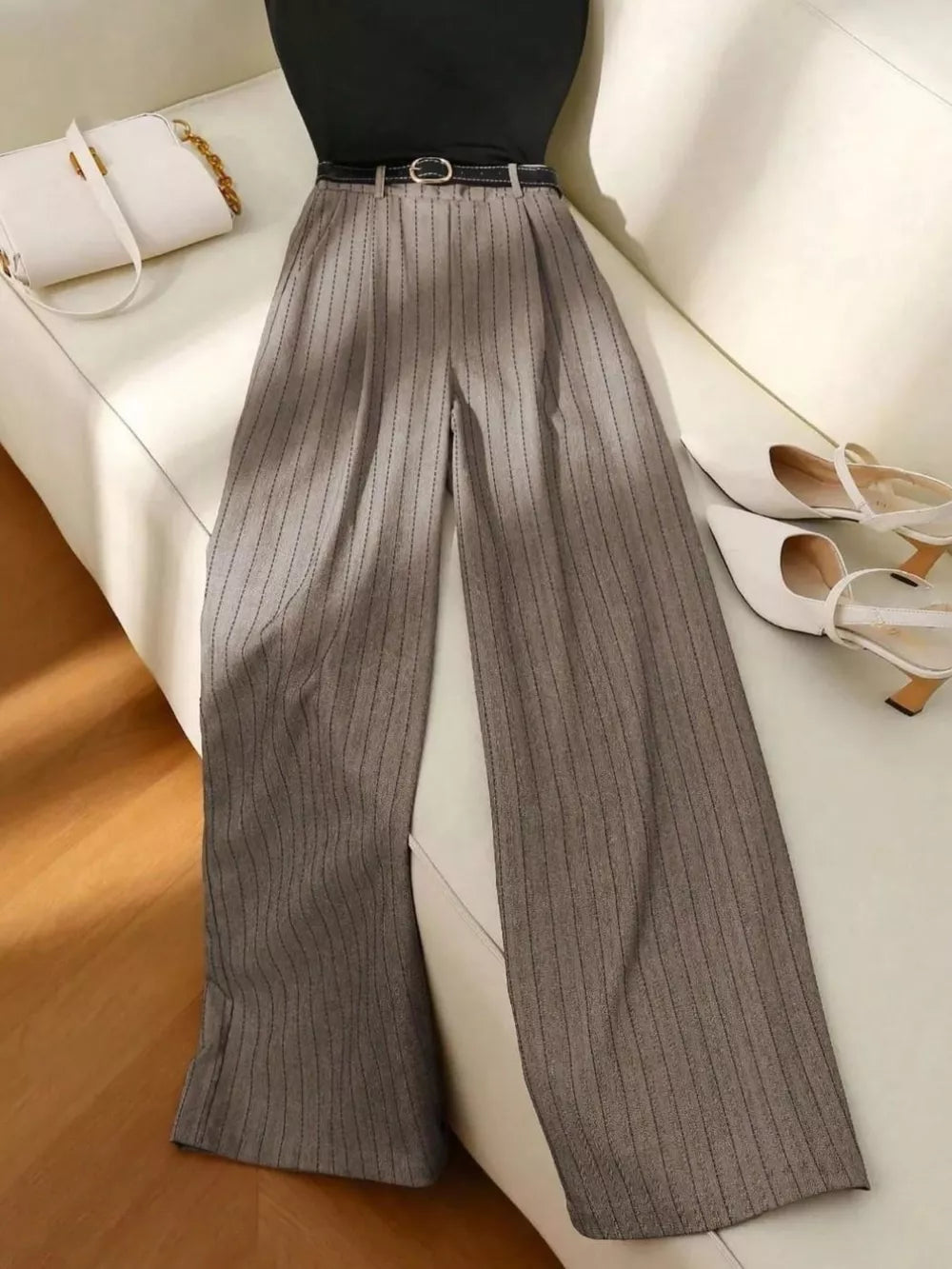 Chic sleeveless top with pinstripe wide-leg pants set in dark gray.
