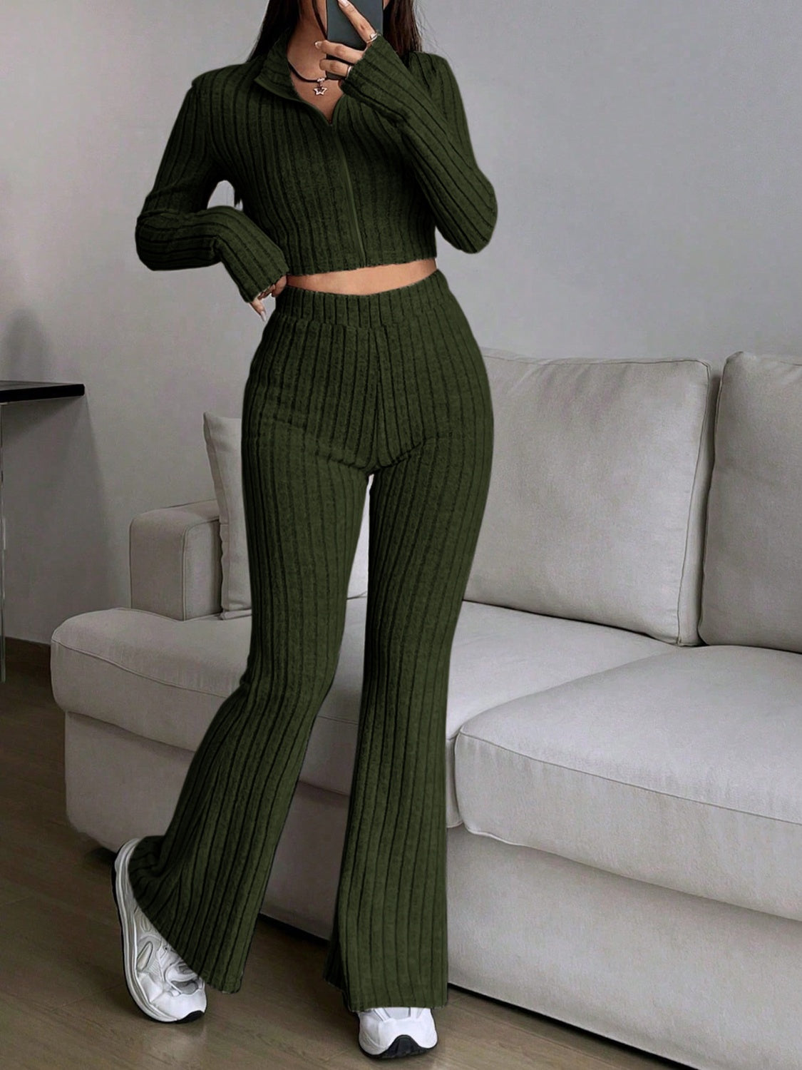 Ribbed knit flare co-ord set in army green with zip-up crop top and high-waisted flared pants.