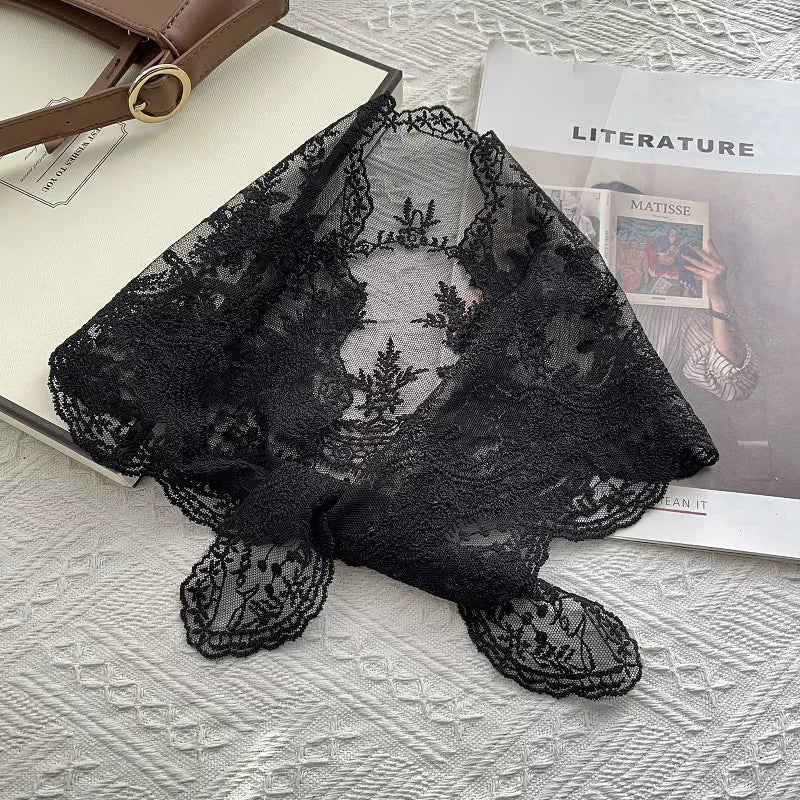 Black delicate floral lace scarf with scalloped edges and intricate embroidery.