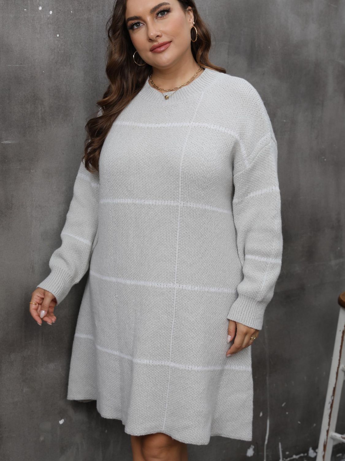 Gray grid-stitch sweater dress with subtle flare and crew neck.