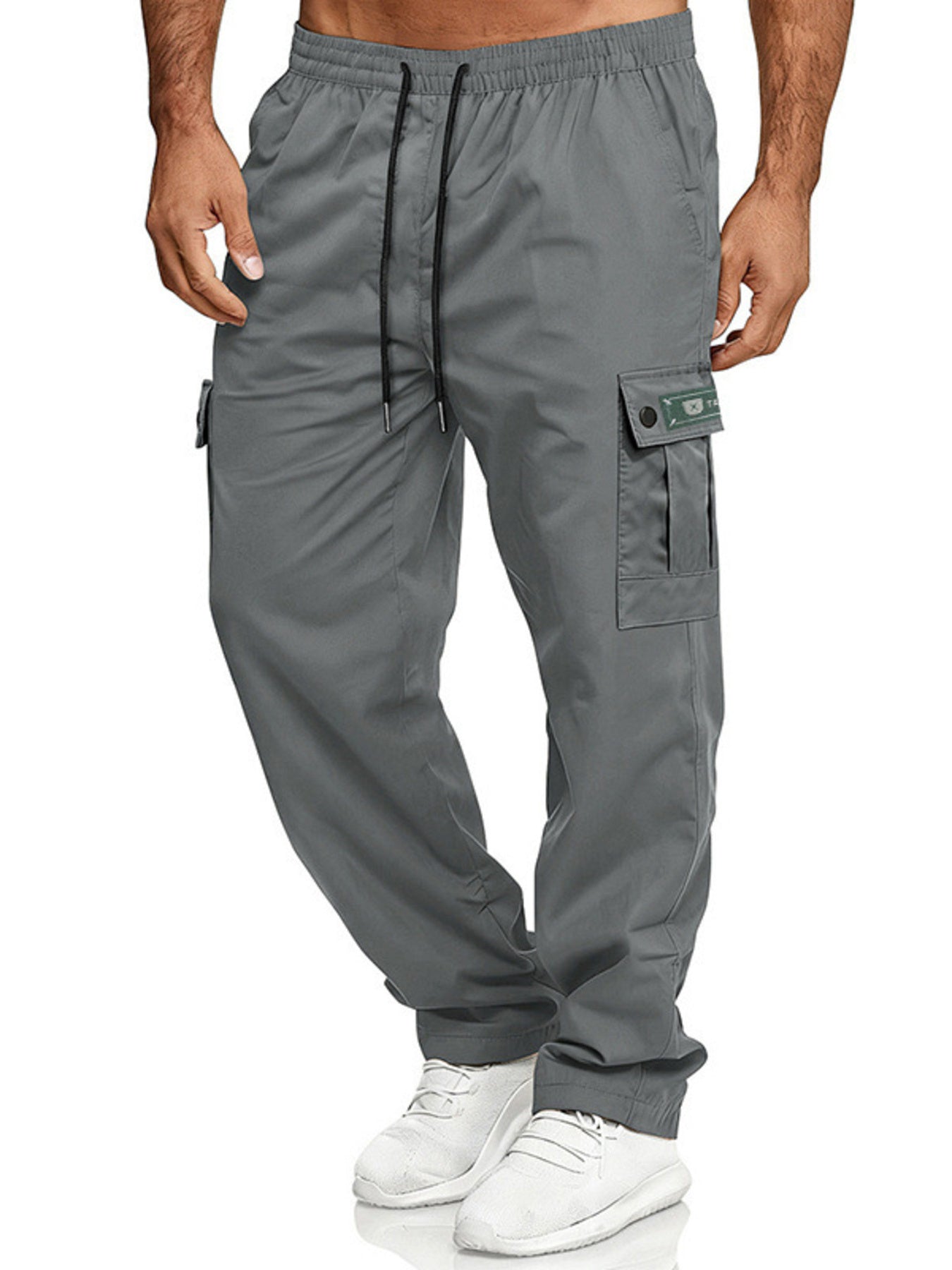 Gray cargo pants with adjustable waist and drawstring, featuring multiple pockets.