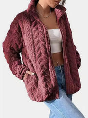 Burgundy textured chevron fleece zip jacket with a stand-up collar and pockets.