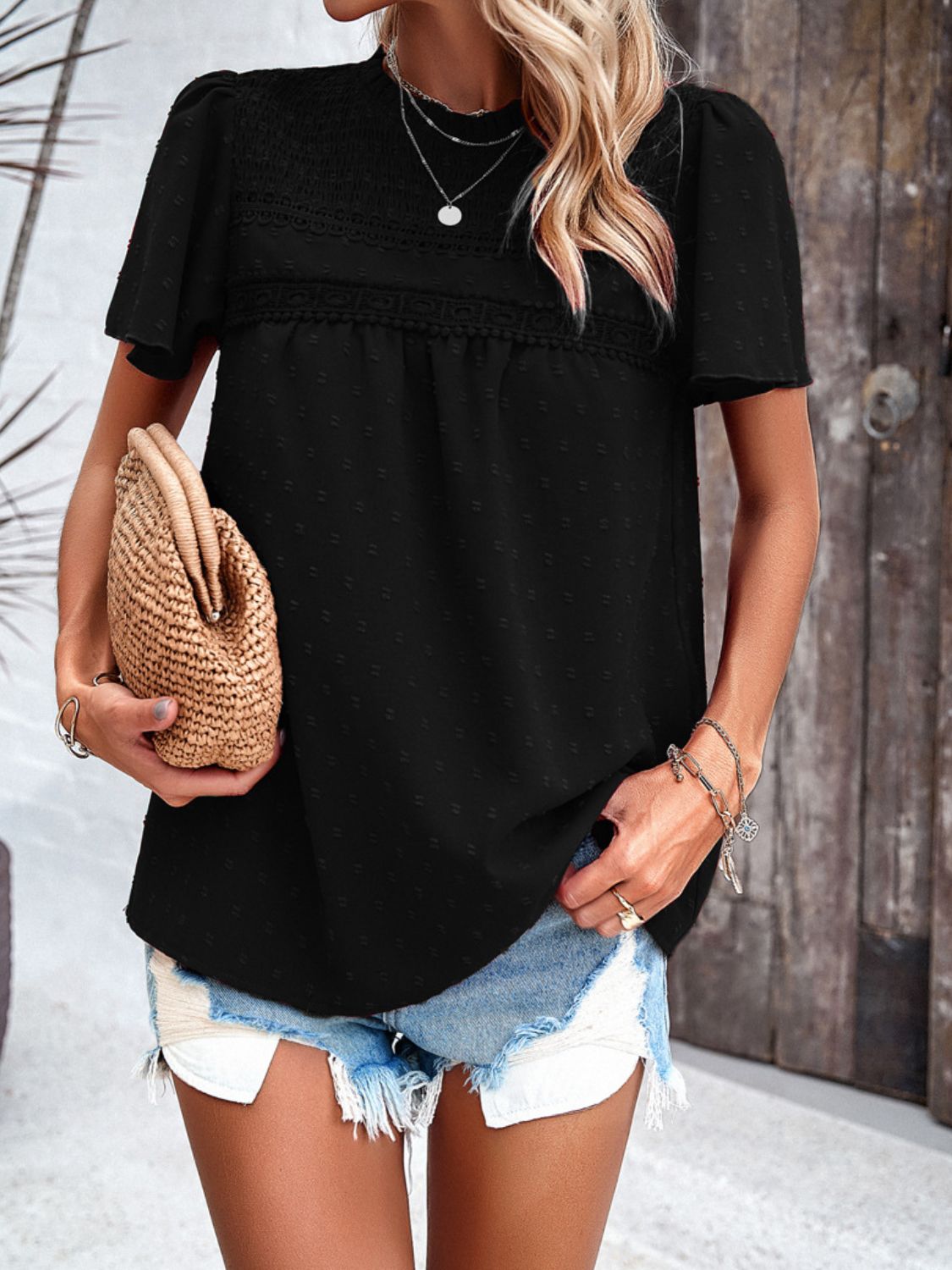 Black dotted swiss smocked bodice flutter sleeve top with lace trim detail