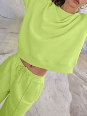 Seamed sweatshirt and wide-leg lounge set in lime, white, or brown.