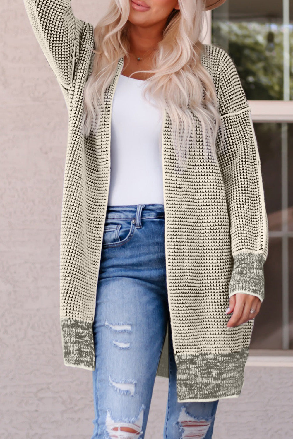 Textured open cardigan in Sand with a knit pattern and puff sleeves.
