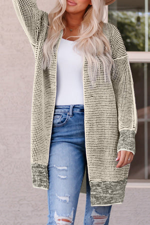 Textured open cardigan in Sand with a knit pattern and puff sleeves.