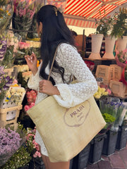 Cream crochet knit sweater with bell sleeves, part of a two-piece set.