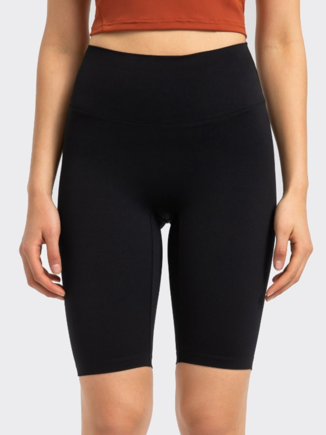 Black active bike shorts with a high waist and seamless design.