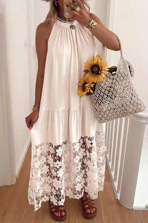 Beige halter maxi dress with floral lace hem and tiered skirt.