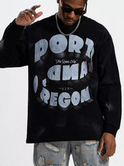 Black oversized long-sleeve tee with "PORTLAND OREGON The Rose City USA" graphic print.