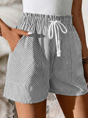 Striped cotton shorts with elastic drawstring waist and pockets.