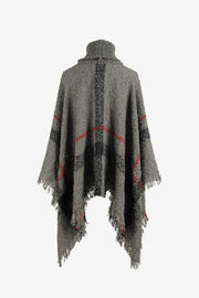 Textured plaid turtleneck cape in charcoal with fringe detail and acrylic blend.
