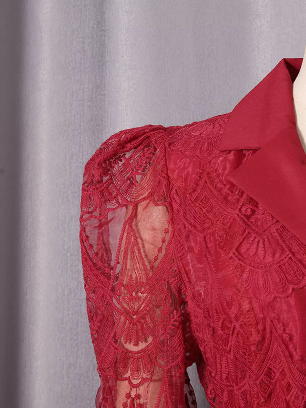 Red lace midi dress with collared neckline and button placket detail.