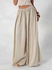 Textured beige cotton maternity pants with wide legs and gathered waist