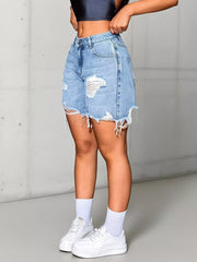 Light wash denim shorts with high waist, distressed rips, and frayed hem.