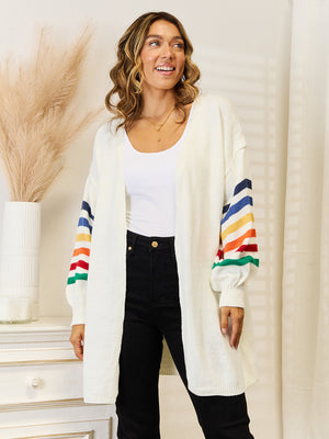 White knit open-front cardigan with rainbow striped sleeves