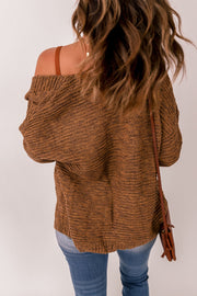 Brown cable knit open-front cocoon cardigan with textured acrylic knit.