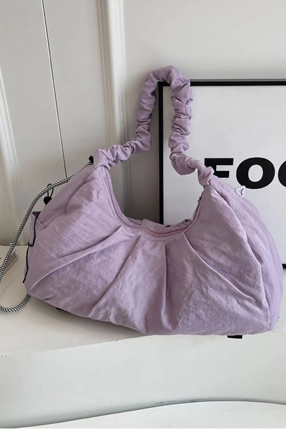 Lilac gathered crescent shoulder bag with ruched strap and pleated detail