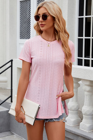 Pink perforated crewneck top with side slits and short sleeves.