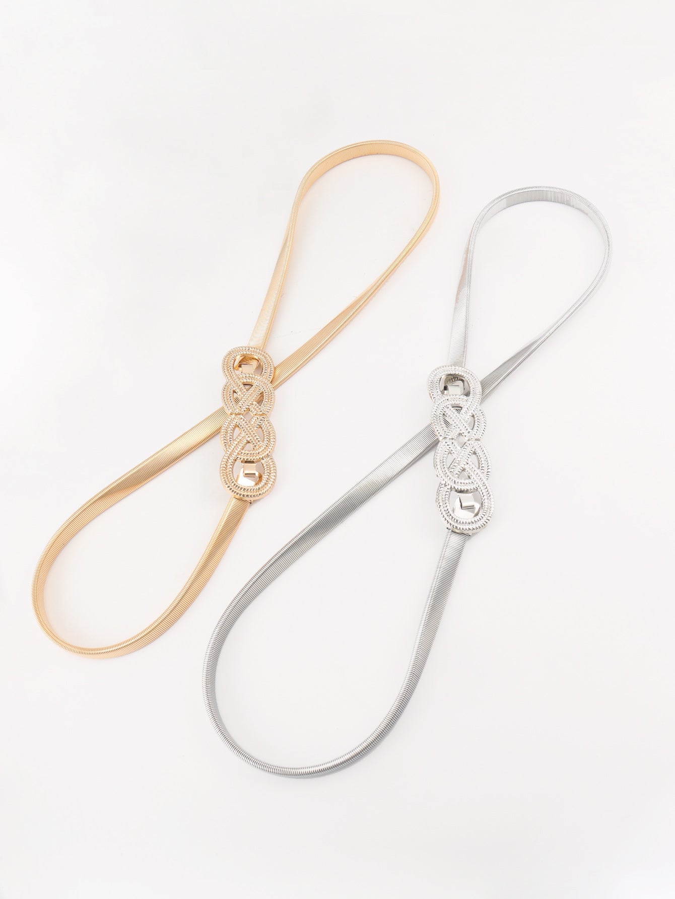 Gold and silver elastic waist belts with intertwined knot detail