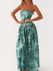 Turquoise floral printed strapless maxi dress with a gathered waist and full skirt.