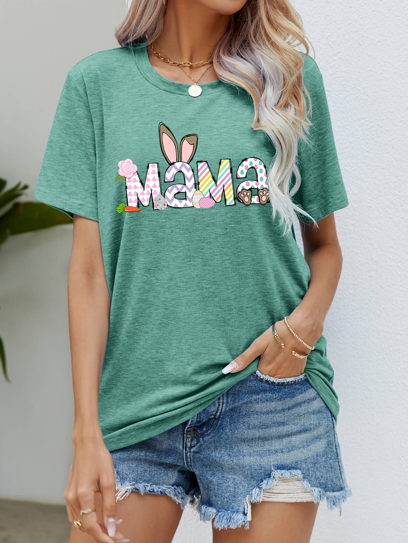 Green graphic t-shirt with Easter bunny ears and "Mama" text, short sleeves, crew neck