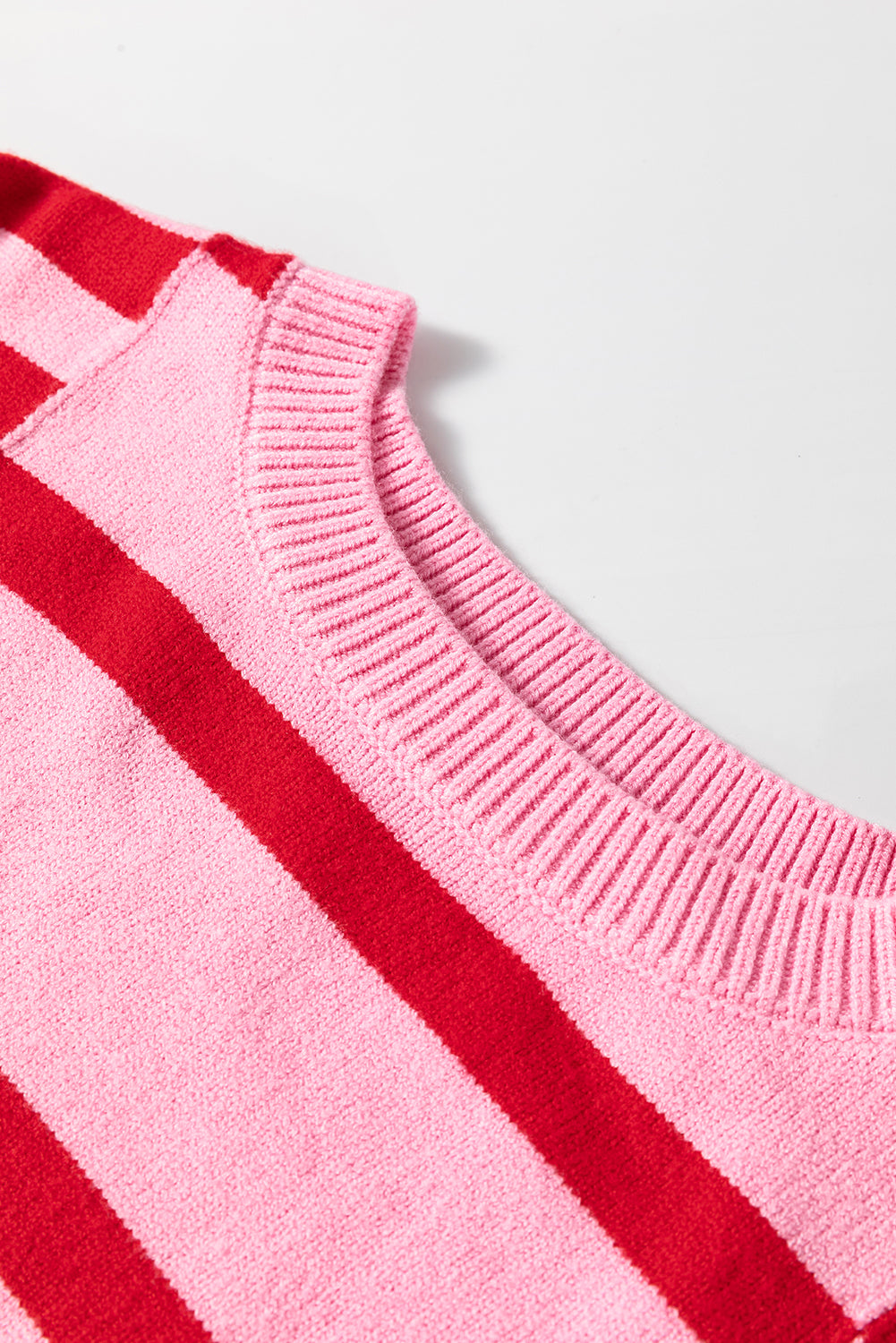 Pink and red striped knit sweater with crew neck detail
