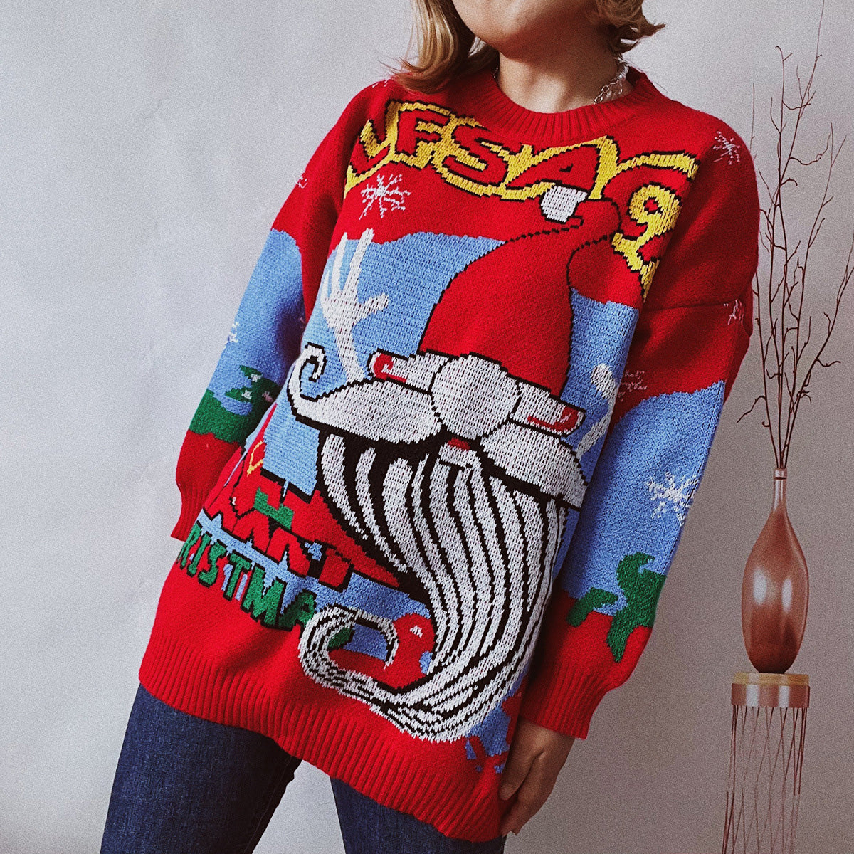 Red knit sweater with Santa Claus and Christmas print, long sleeves, crew neck.