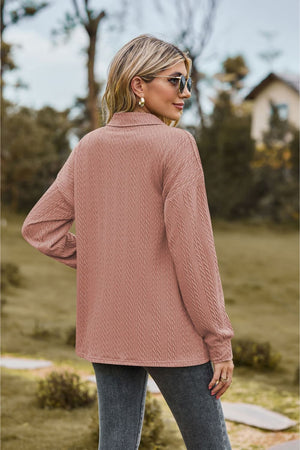 Textured knit polo shirt in Dusty Pink with a collared neckline and long sleeves.