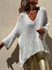 White open knit sweater with asymmetric hem and beaded trim detail.