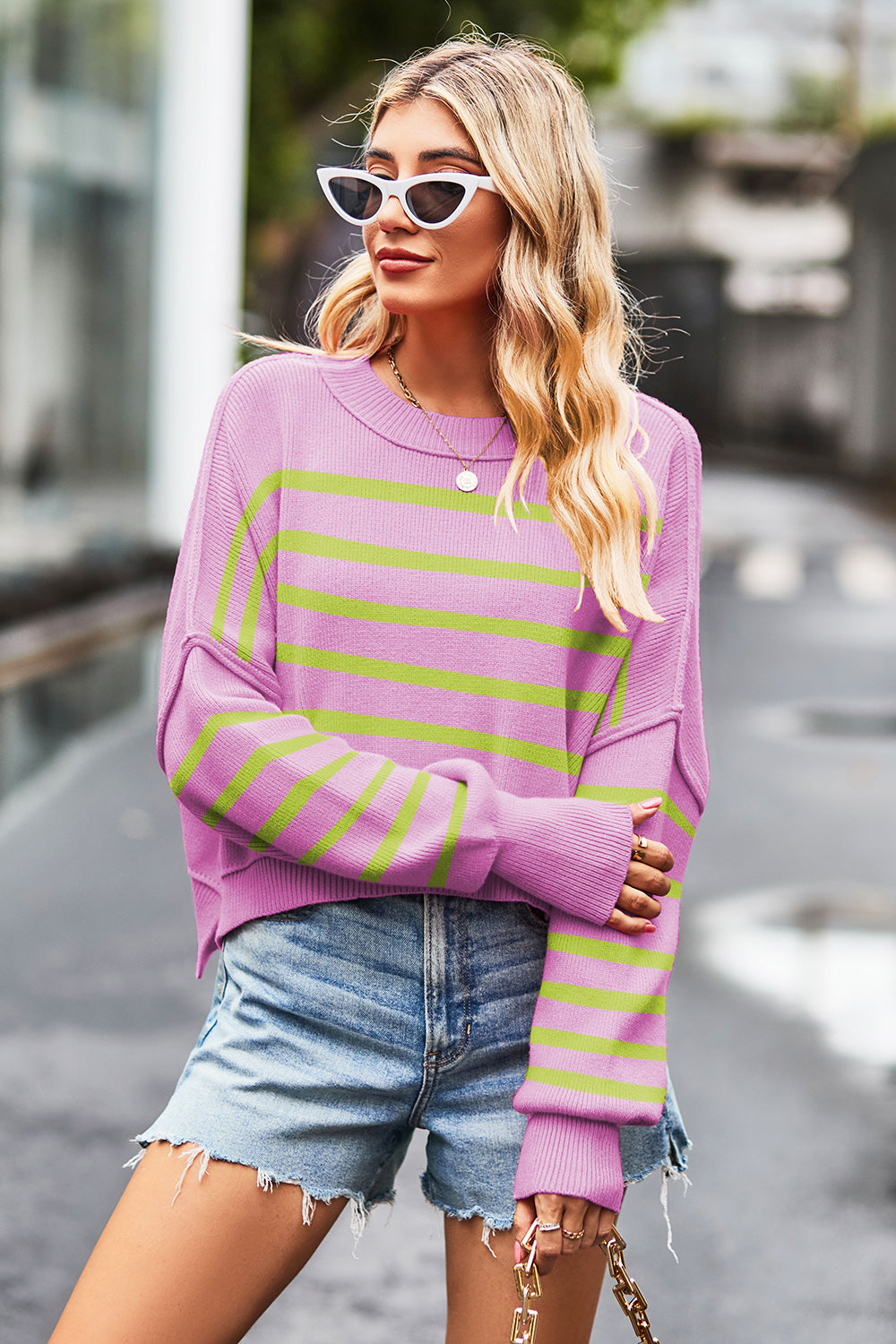Pink and lime green striped knit crewneck sweater with boxy fit.