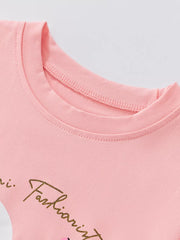 Blush pink toddler girls' t-shirt with gold script graphic detail.