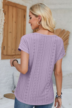 Lavender perforated eyelet cuffed tee with short sleeves and a scoop neckline.