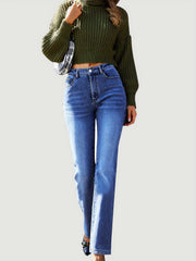 Women's medium wash denim jeans with a subtle flare and high waist.
