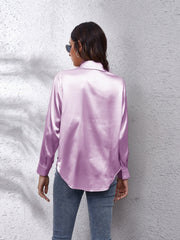 Lilac silky button-down shirt with long sleeves and a relaxed fit.
