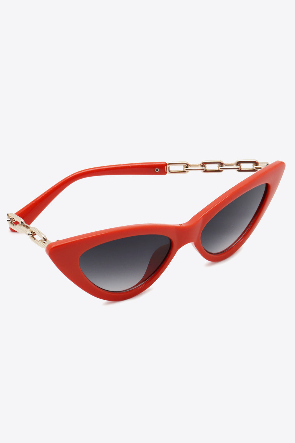 Chainlink cat-eye sunglasses in deep red with gold chain detail and gradient lenses.