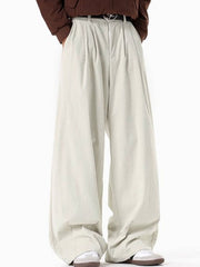 Men's cream pleated wide leg corduroy trousers with a relaxed fit.
