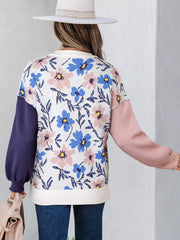 Patchwork floral sweater with contrasting sleeves and crew neck.