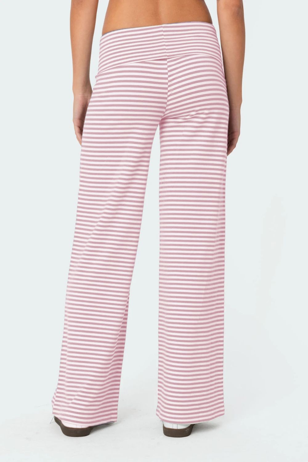 Blush pink and white striped palazzo pants with a high waist.