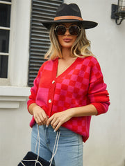 Checkerboard block knit cardigan in red and pink with button front and V-neck.