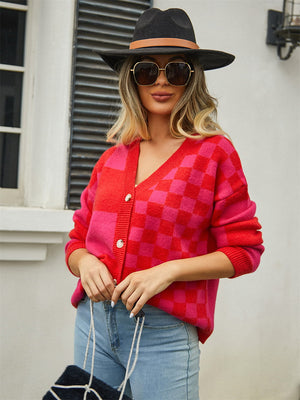 Checkerboard block knit cardigan in red and pink with button front and V-neck.