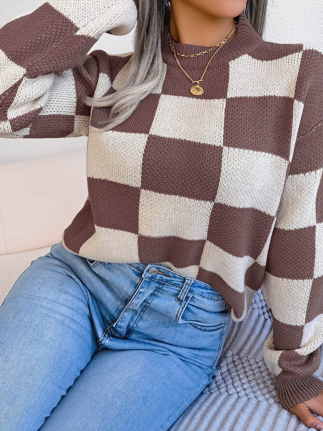 Checkerboard knit mock neck pullover sweater in brown and cream acrylic.