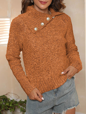Tangerine textured knit sweater with pearl button asymmetric collar and long sleeves.